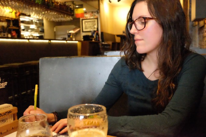 Taking notes at Moeder Lambic, Brussels, Belgium.